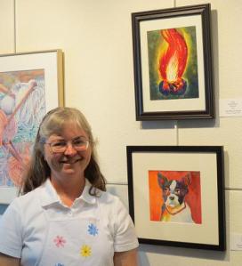 Julie with her "Campfire" watercolor painting at Instructor-Student Art Exhibit --BTAC